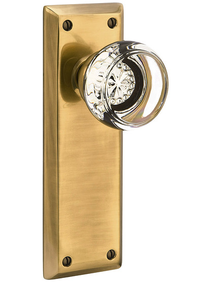 Quincy Door Set with Georgetown Knobs in Antique Brass.